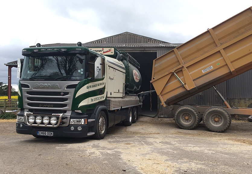 Straight Rolling Barley out of a trailer on a Beef Farm.